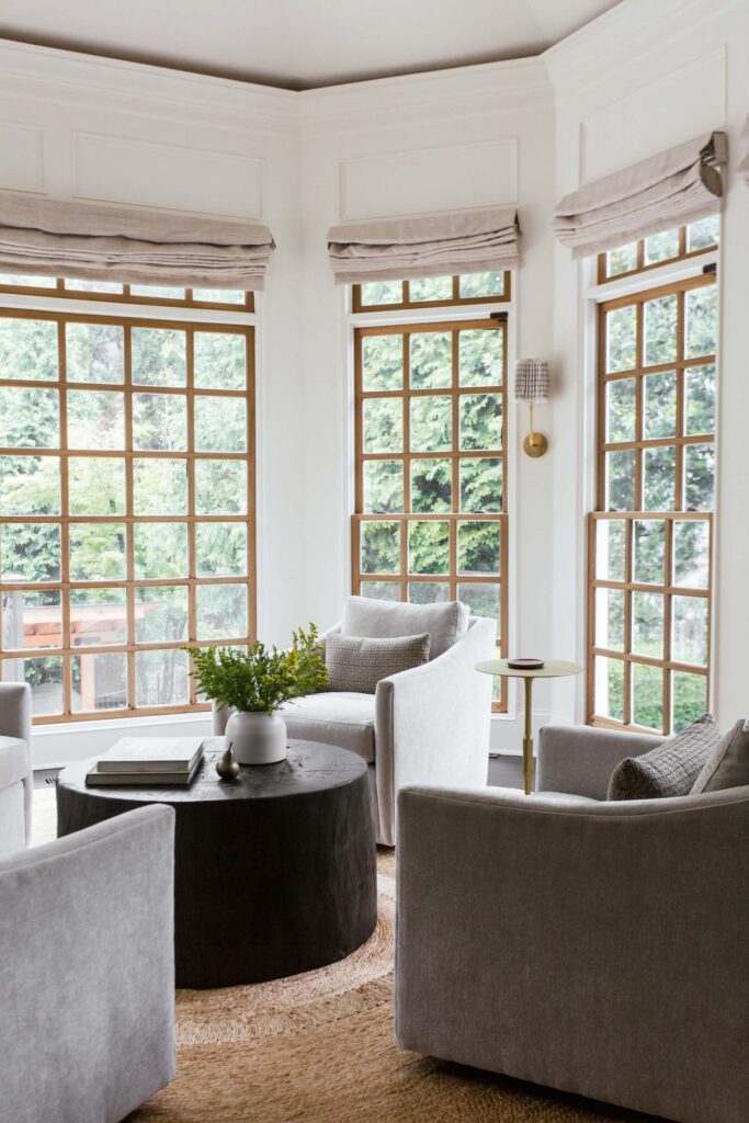 living area with wooden coffee table and grey lounge chairs