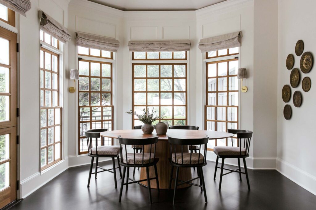 dining room with round dining table and curved dining chairs