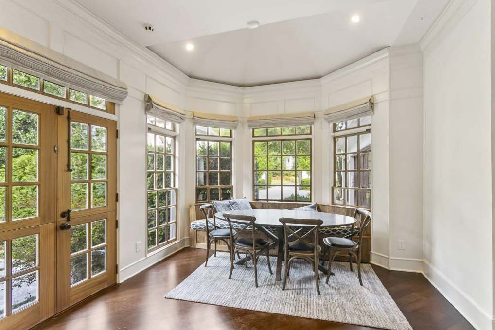 breakfast area with rounded booth and cushioned seating