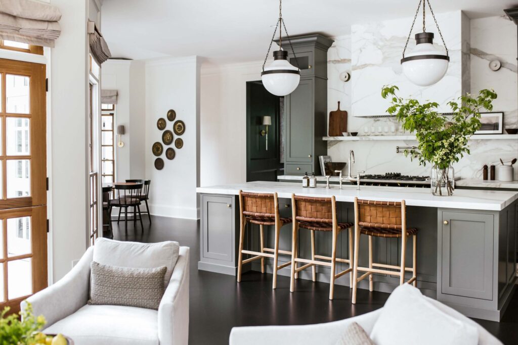 country club main kitchen with grey cabinets and woven barstools