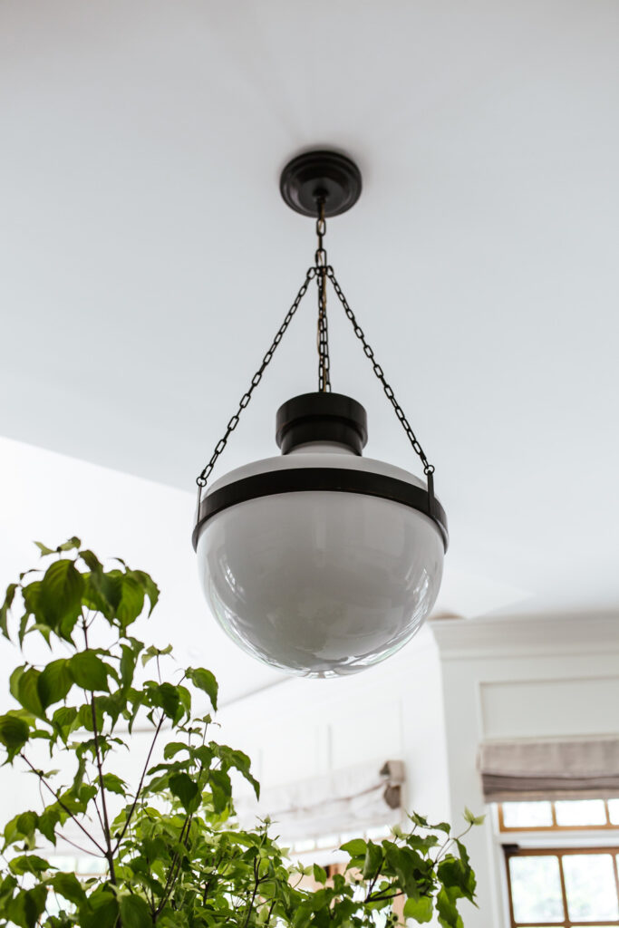 darkened brass light fixture in main kitchen