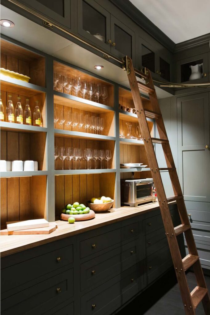 butler's pantry with wood counters and open shelving and dark cupboards