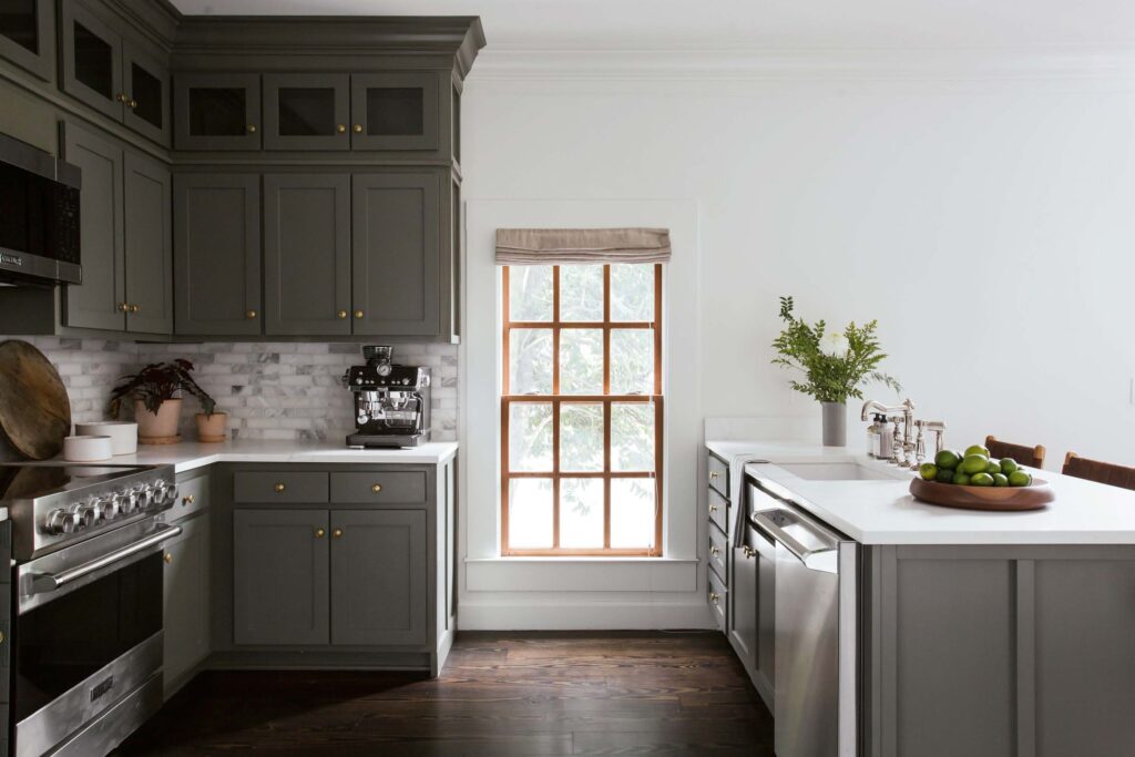 Guest kitchen window with Pottery Barn natural linen shades.